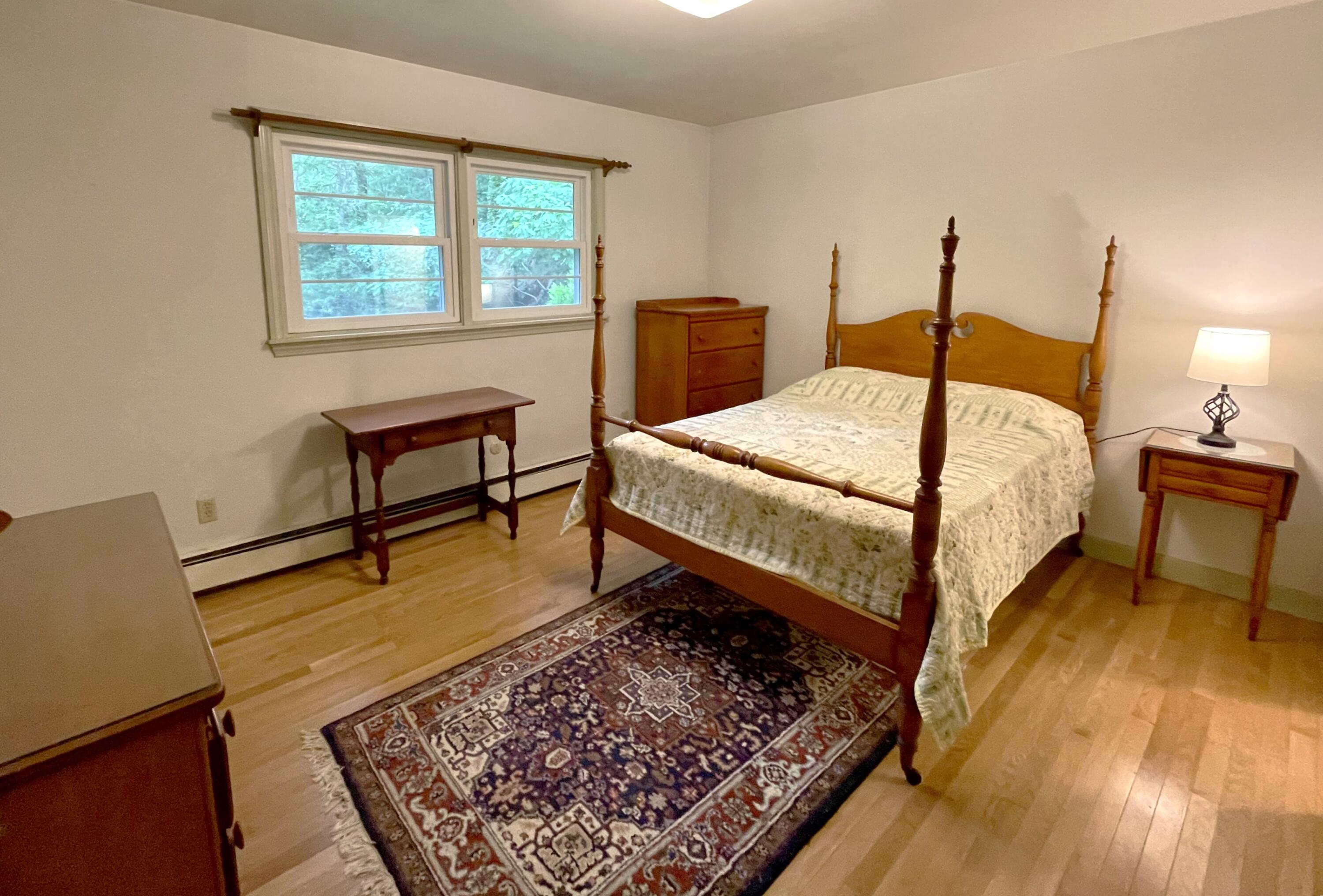 73 Tern Lane Centerville, MA 02632 - Photo 14 of 31 a bed sitting in a bedroom next to a window