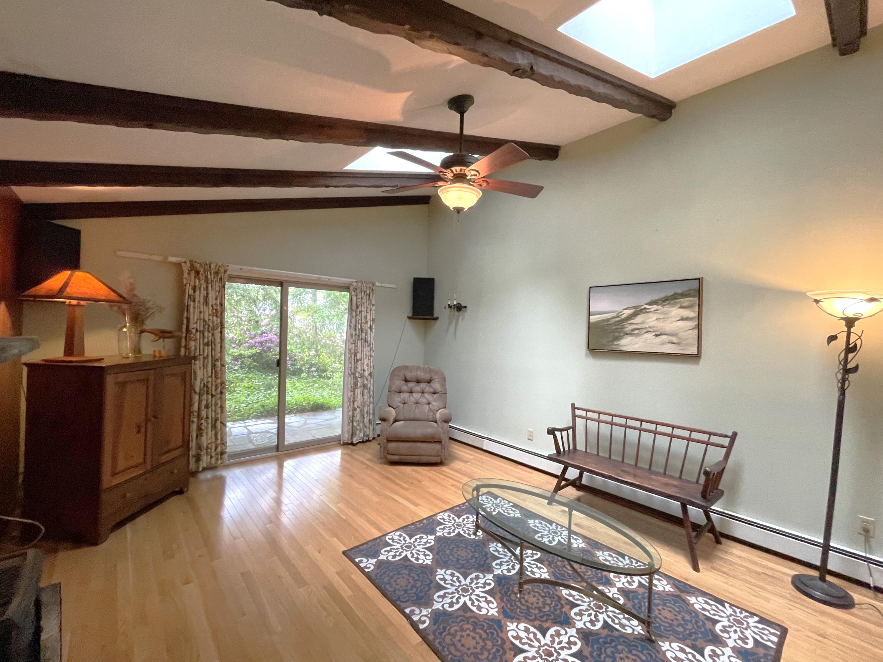 73 Tern Lane Centerville, MA 02632 - Photo 5 of 31 a living room with furniture and a rug