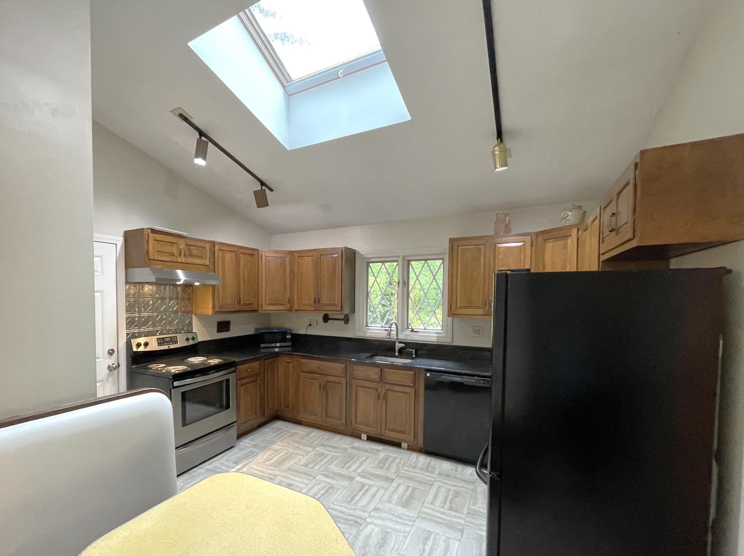 73 Tern Lane Centerville, MA 02632 - Photo 6 of 31 a kitchen with stainless steel appliances granite countertop a sink stove and refrigerator
