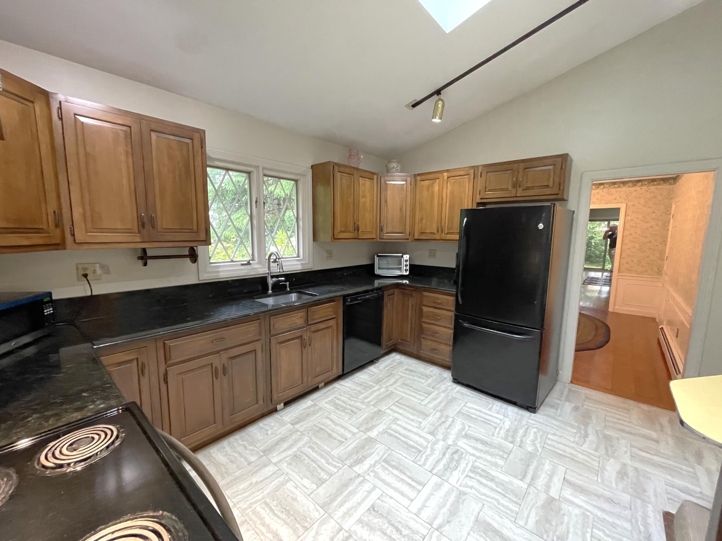 73 Tern Lane Centerville, MA 02632 - Photo 7 of 31 a kitchen with stainless steel appliances granite countertop a refrigerator a sink a stove a microwave and island
