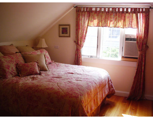 85 Gleason Road Lexington, MA 02420 - Photo 8 of 10 a bedroom with a bed and a window