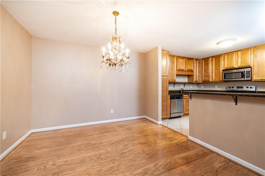 1468 Briarwood Road Northeast, Unit 1005 Atlanta, GA 30319 - Photo 19 of 45 a view of kitchen with sink and microwave