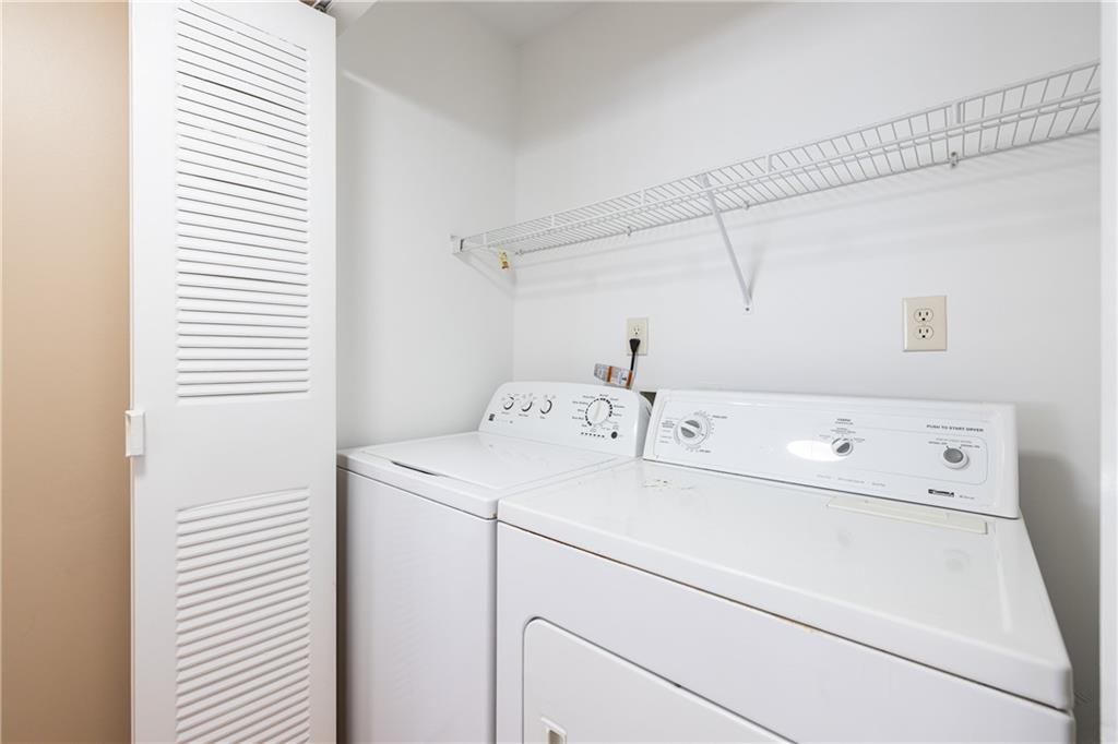 1468 Briarwood Road Northeast, Unit 1005 Atlanta, GA 30319 - Photo 37 of 45 a utility room with dryer and washer