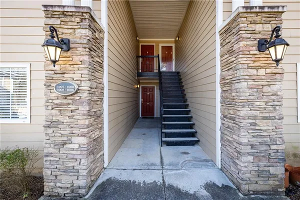a view of a workspace with furniture and windows