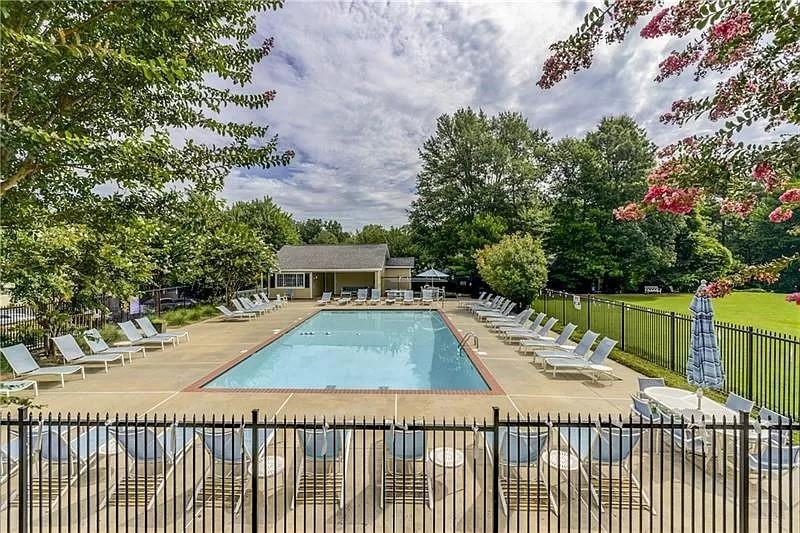 1468 Briarwood Road Northeast, Unit 1005 Atlanta, GA 30319 - Photo 42 of 45 a view of a swimming pool with a patio