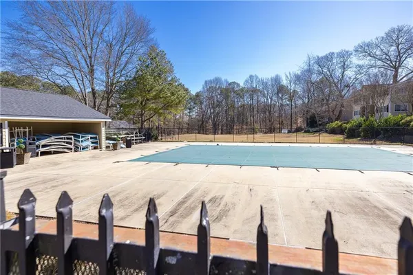 a view of a swimming pool with lounge chairs