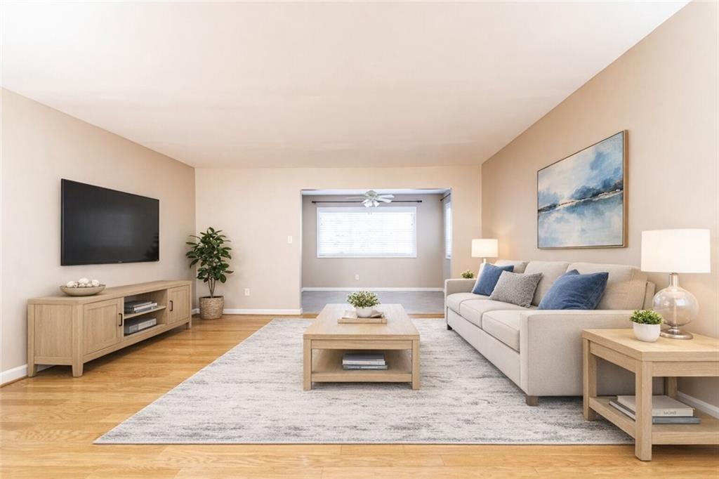 1468 Briarwood Road Northeast, Unit 1005 Atlanta, GA 30319 - Photo 6 of 45 a living room with furniture and a flat screen tv