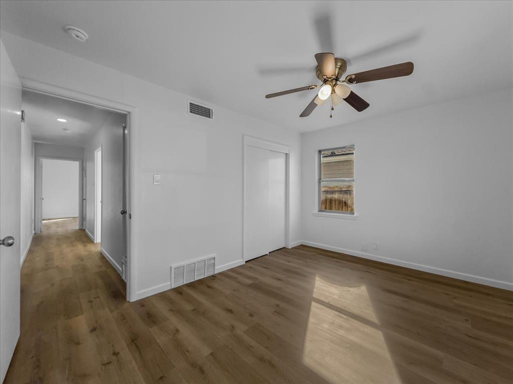 1236 Harrison Lane Hurst, TX 76053 - Photo 25 of 25 a view of empty room with wooden floor