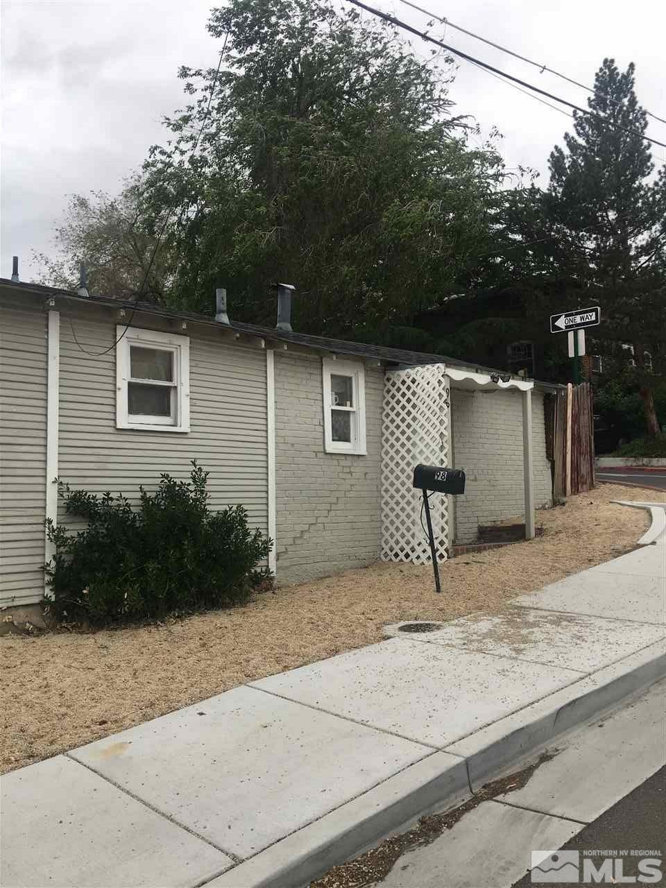 1395 Terrace Drive Reno, NV 89503 - Photo 6 of 7 a view of a house with backyard and trees