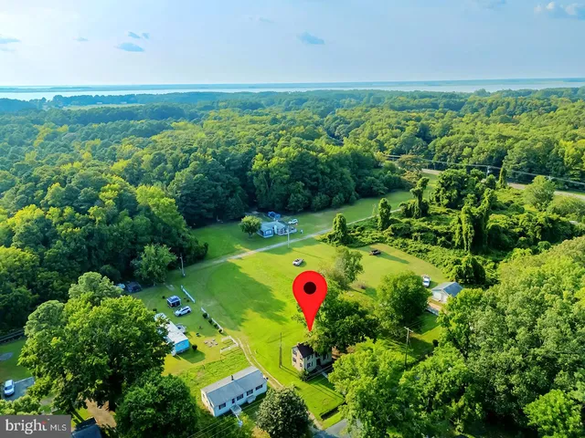 a view of a golf course with houses