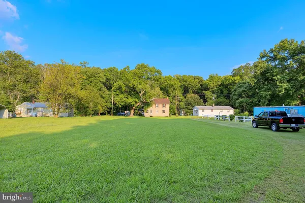 a view of a house with a big yard