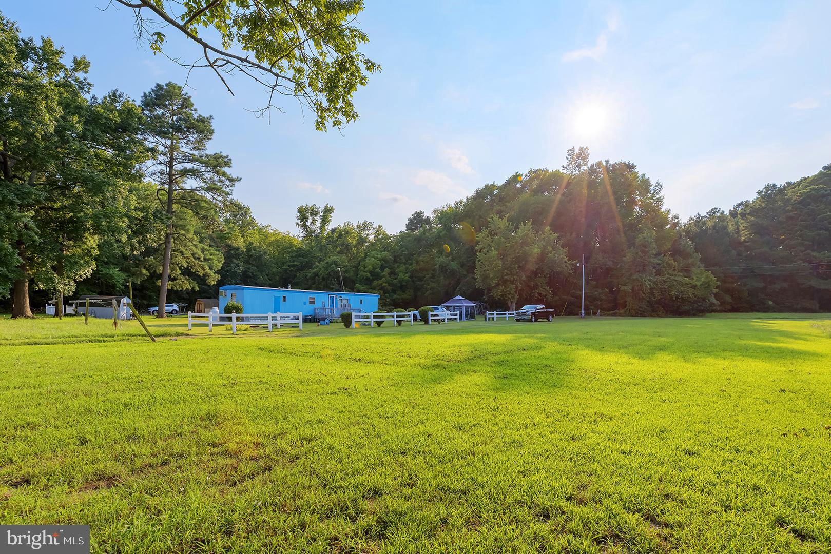 4152 Jesterville Road Tyaskin, MD 21865 - Photo 7 of 21 a swimming pool with trees in the background