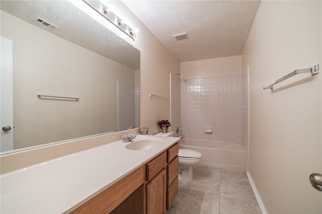 11228 Pickard Lane Austin, TX 78748 - Photo 21 of 32 a bathroom with a sink a toilet and shower