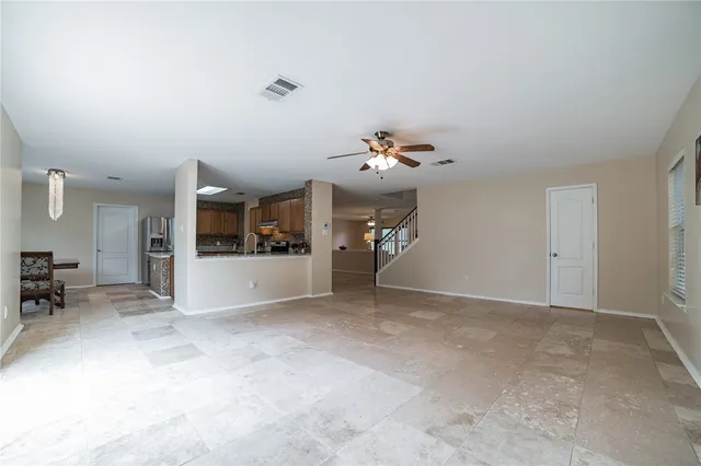 a view of livingroom and kitchen with sink