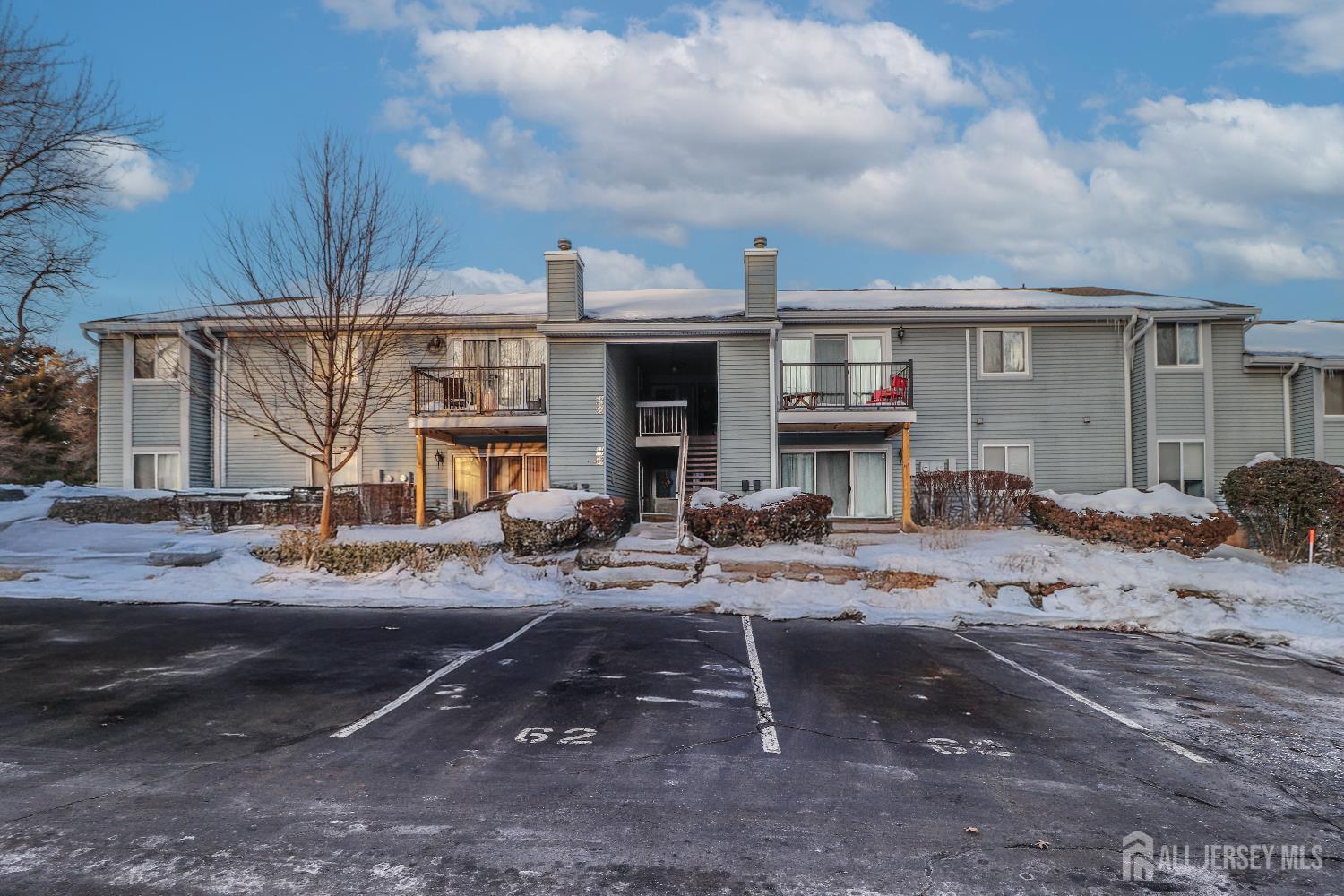 a view of a house with snow on the road