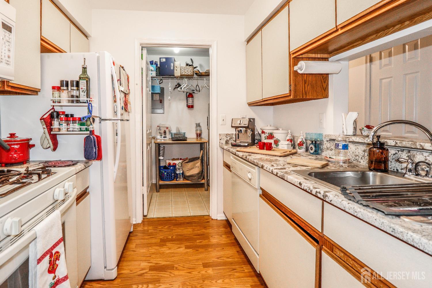 62 Haverhill Place Somerset, NJ 08873 - Photo 13 of 26 a kitchen with a sink stove and cabinets