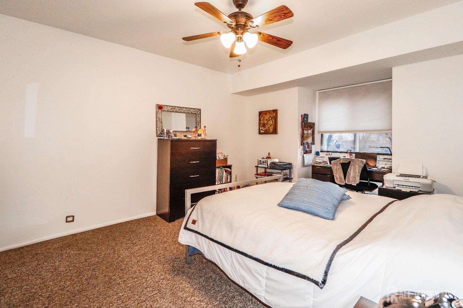 62 Haverhill Place Somerset, NJ 08873 - Photo 19 of 26 a bed room with a bed and a chandelier