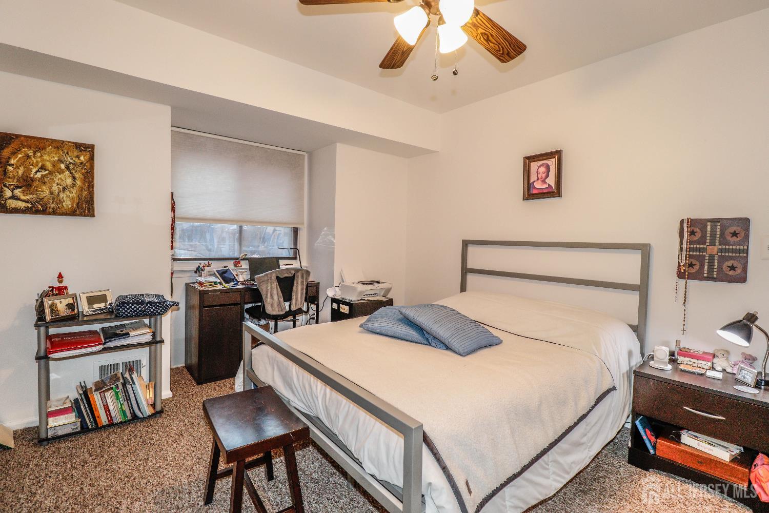 62 Haverhill Place Somerset, NJ 08873 - Photo 20 of 26 a bedroom with a bed and a chandelier