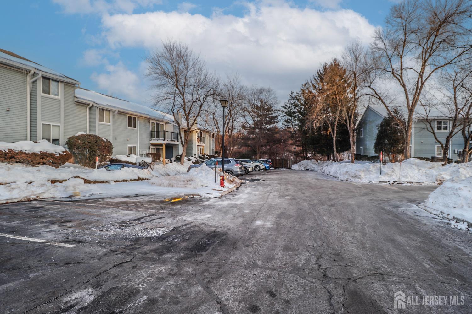 62 Haverhill Place Somerset, NJ 08873 - Photo 2 of 26 a row of houses with a street