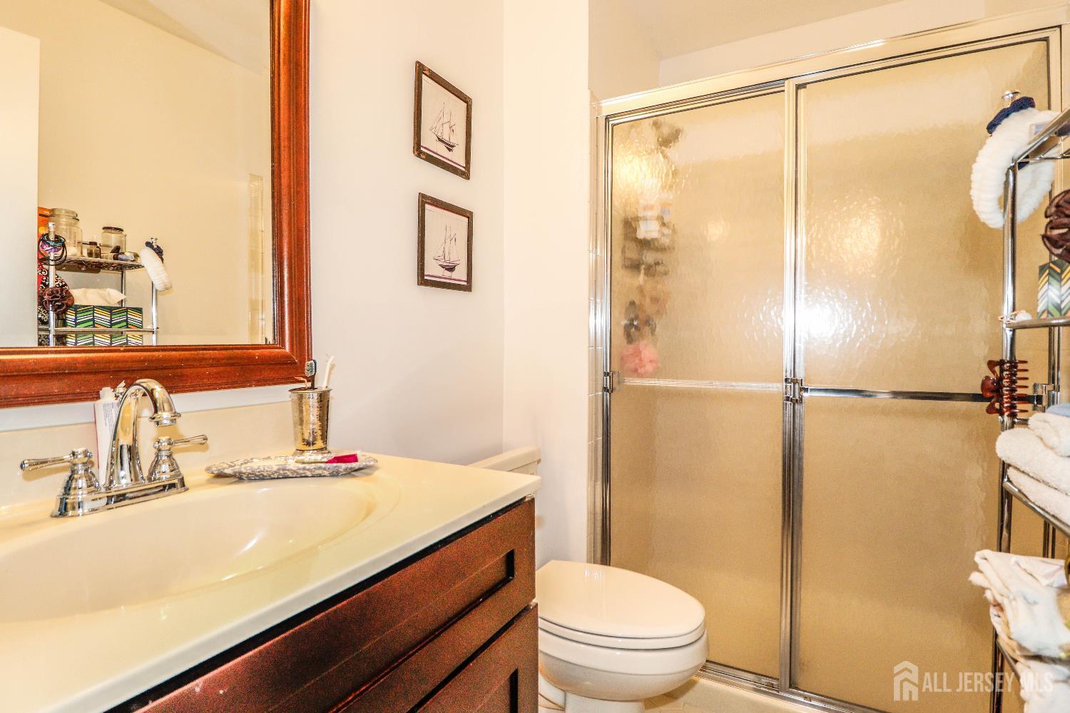 62 Haverhill Place Somerset, NJ 08873 - Photo 23 of 26 a bathroom with a sink toilet and shower