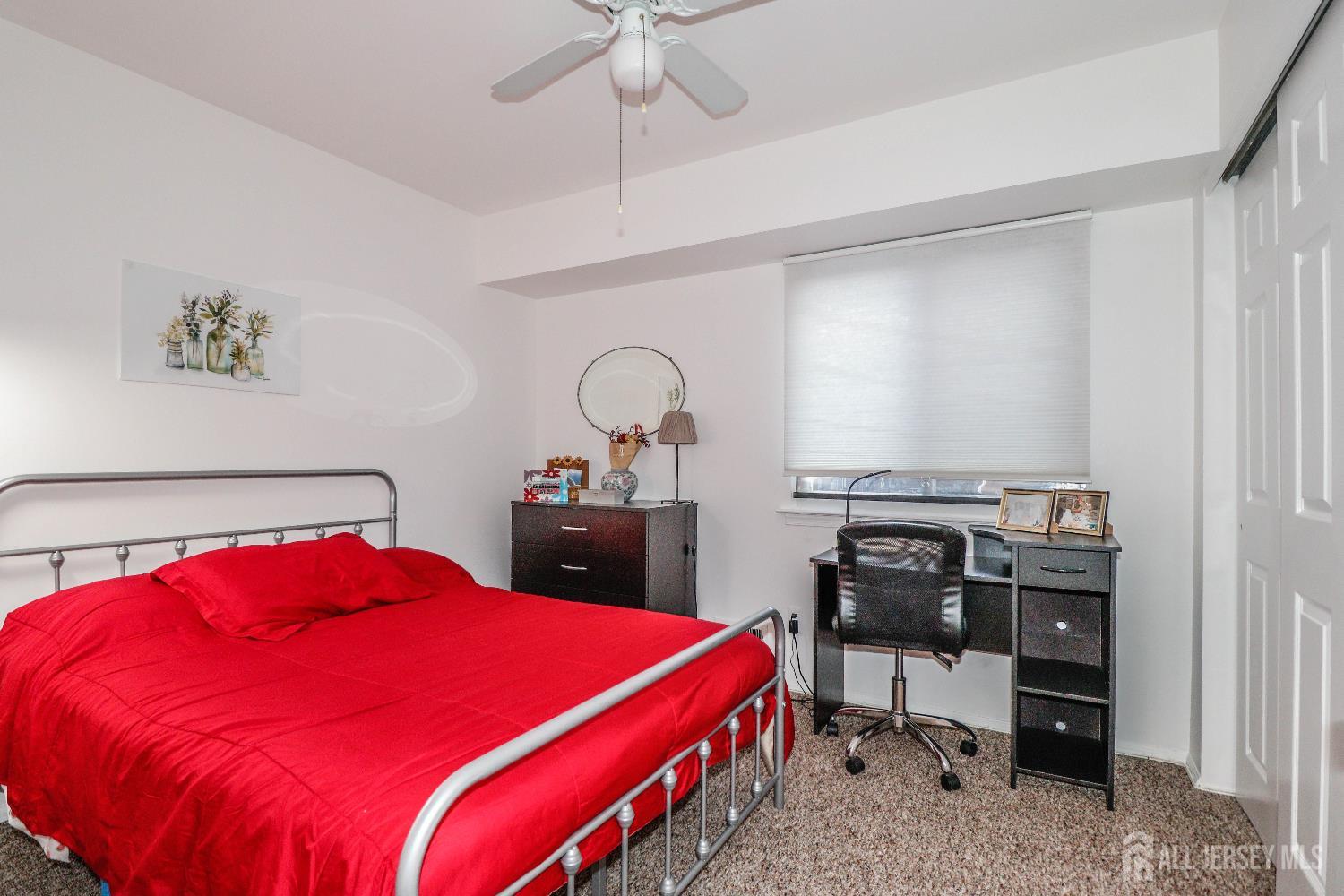 62 Haverhill Place Somerset, NJ 08873 - Photo 25 of 26 a bed room with a bed and a fish tank