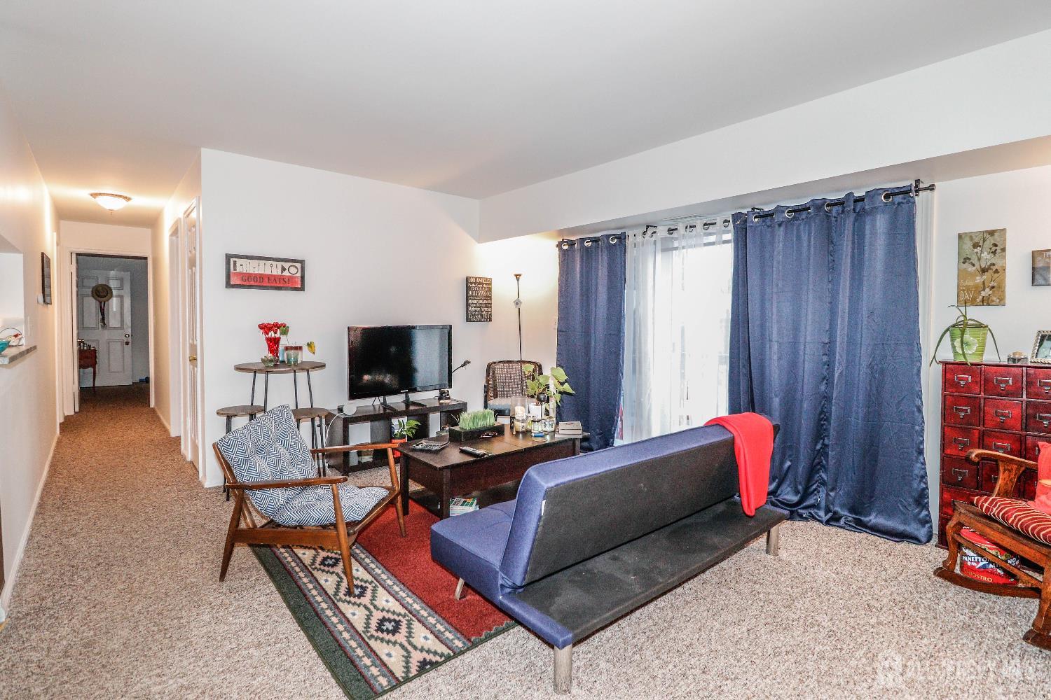 62 Haverhill Place Somerset, NJ 08873 - Photo 5 of 26 a living room with furniture and a flat screen tv