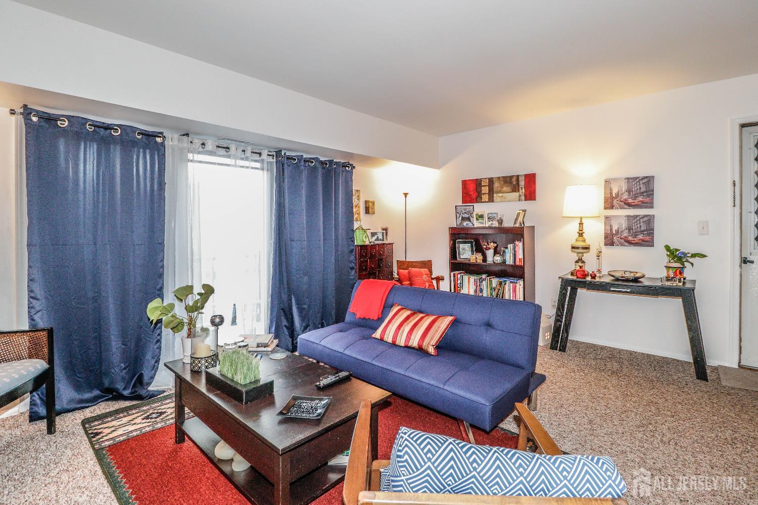 62 Haverhill Place Somerset, NJ 08873 - Photo 6 of 26 a living room with furniture a rug and a window