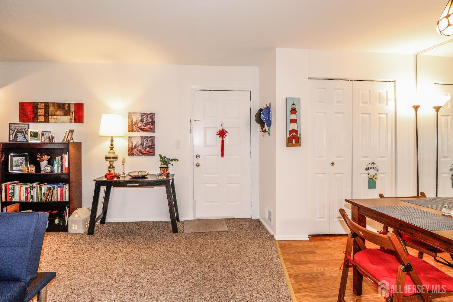 62 Haverhill Place Somerset, NJ 08873 - Photo 8 of 26 a living room with furniture and a book shelf