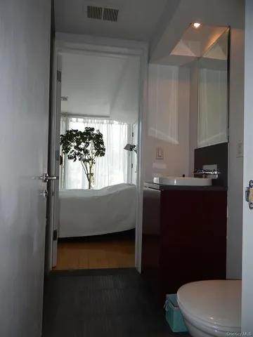 a bathroom with a bathtub toilet and sink