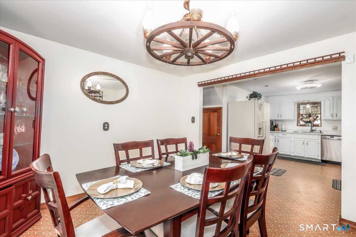 306 Welton Street Hamden, CT 06517 - Photo 9 of 38 a view of a dining room with furniture and wooden floor