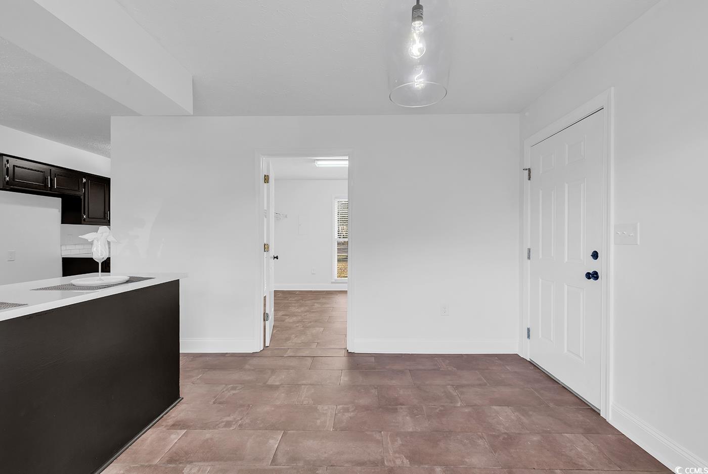 506 Merrywood Drive Conway, SC 29526 - Photo 13 of 40 Unfurnished dining area with baseboards