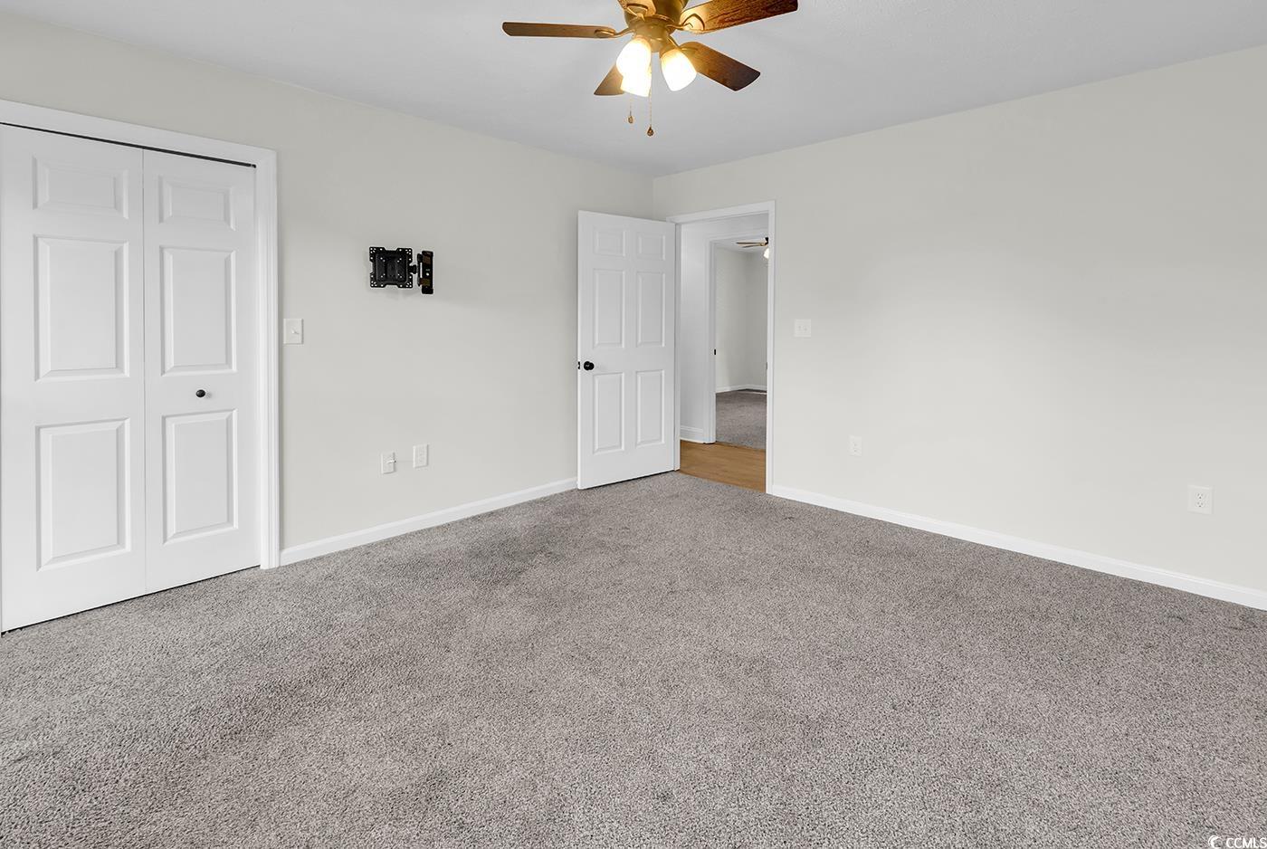 506 Merrywood Drive Conway, SC 29526 - Photo 24 of 40 Unfurnished bedroom with carpet flooring, a closet, and a ceiling fan