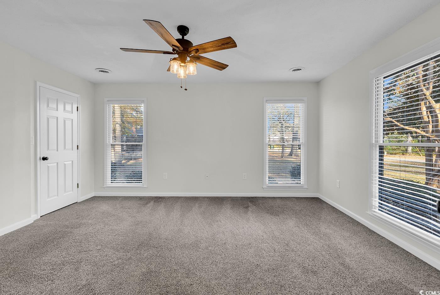 506 Merrywood Drive Conway, SC 29526 - Photo 27 of 40 Empty room with carpet floors and a ceiling fan