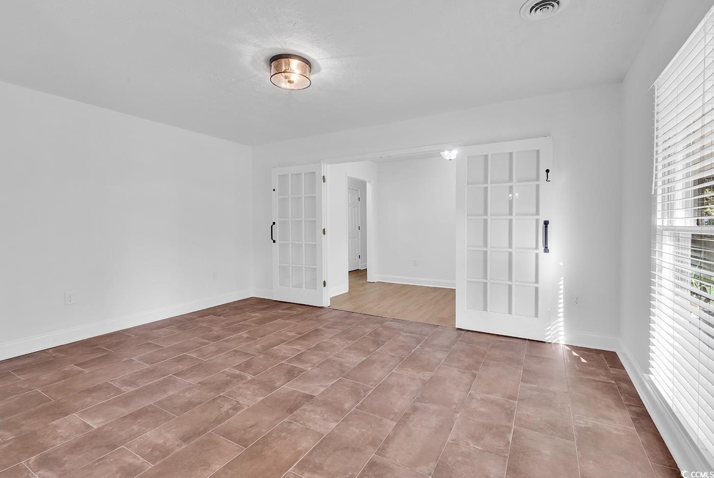 506 Merrywood Drive Conway, SC 29526 - Photo 4 of 40 Empty room featuring french doors and baseboards