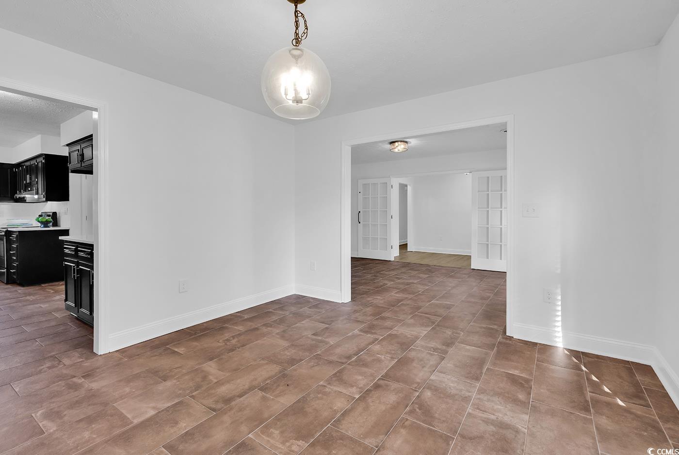 506 Merrywood Drive Conway, SC 29526 - Photo 6 of 40 Unfurnished dining area with french doors and baseboards