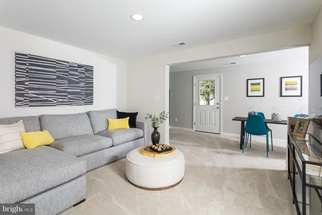a living room with furniture and window