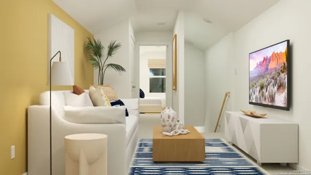 a living room with furniture and a rug