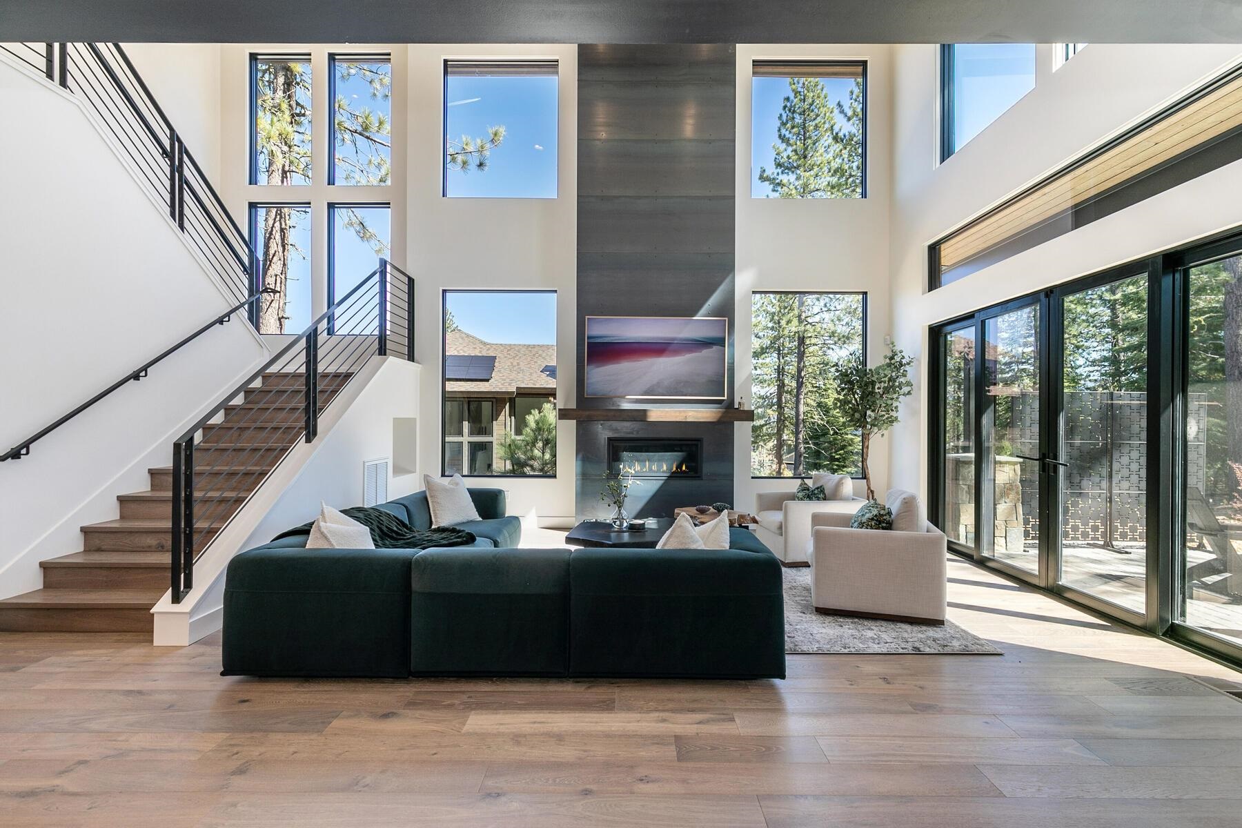10244 Modane Place Truckee, CA 96161 - Photo 7 of 21 a living room with fireplace furniture and a floor to ceiling window