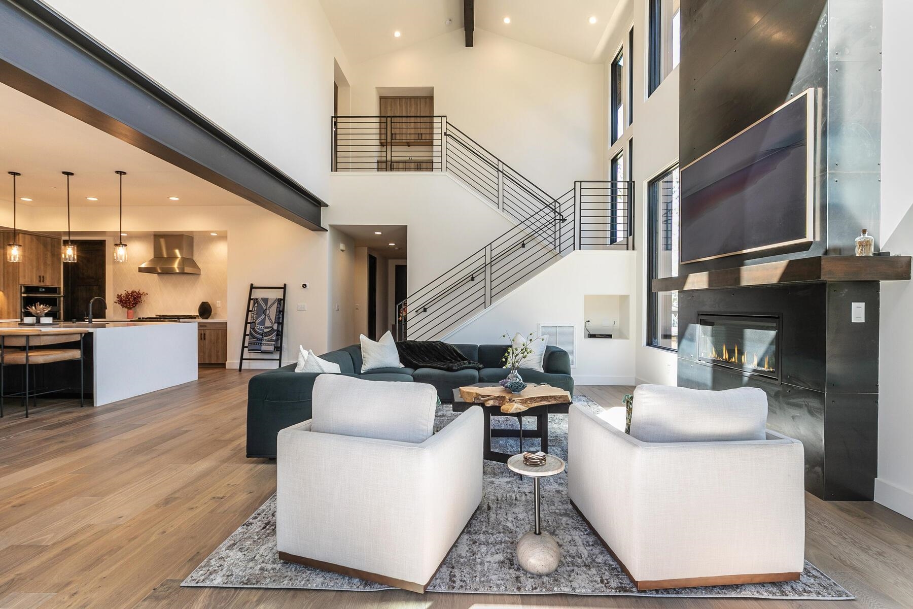 10244 Modane Place Truckee, CA 96161 - Photo 8 of 21 a living room with couches chairs and kitchen view with wooden floor