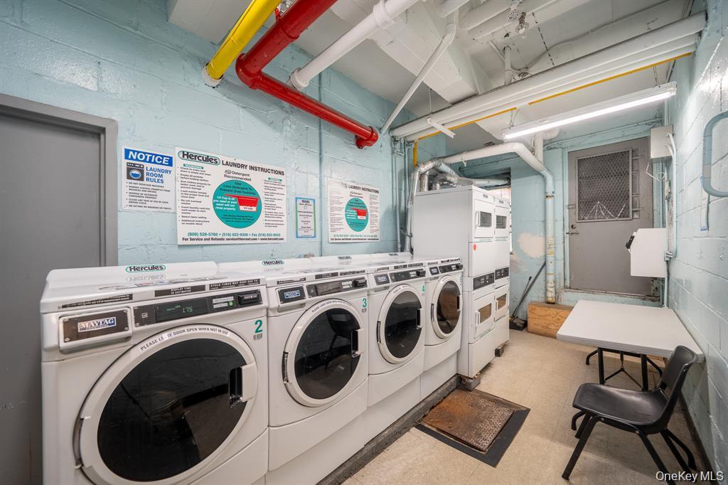 141-30 84th Road, Unit 5E Queens, NY 11435 - Photo 13 of 13 Community laundry with estacked washer and dryer and washer and dryer
