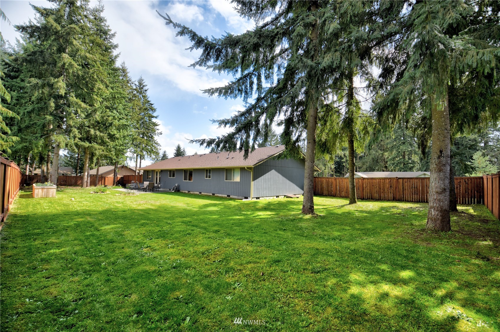 6142 189th Loop Southwest Rochester, WA 98579 - Photo 2 of 35 a view of a house with a yard