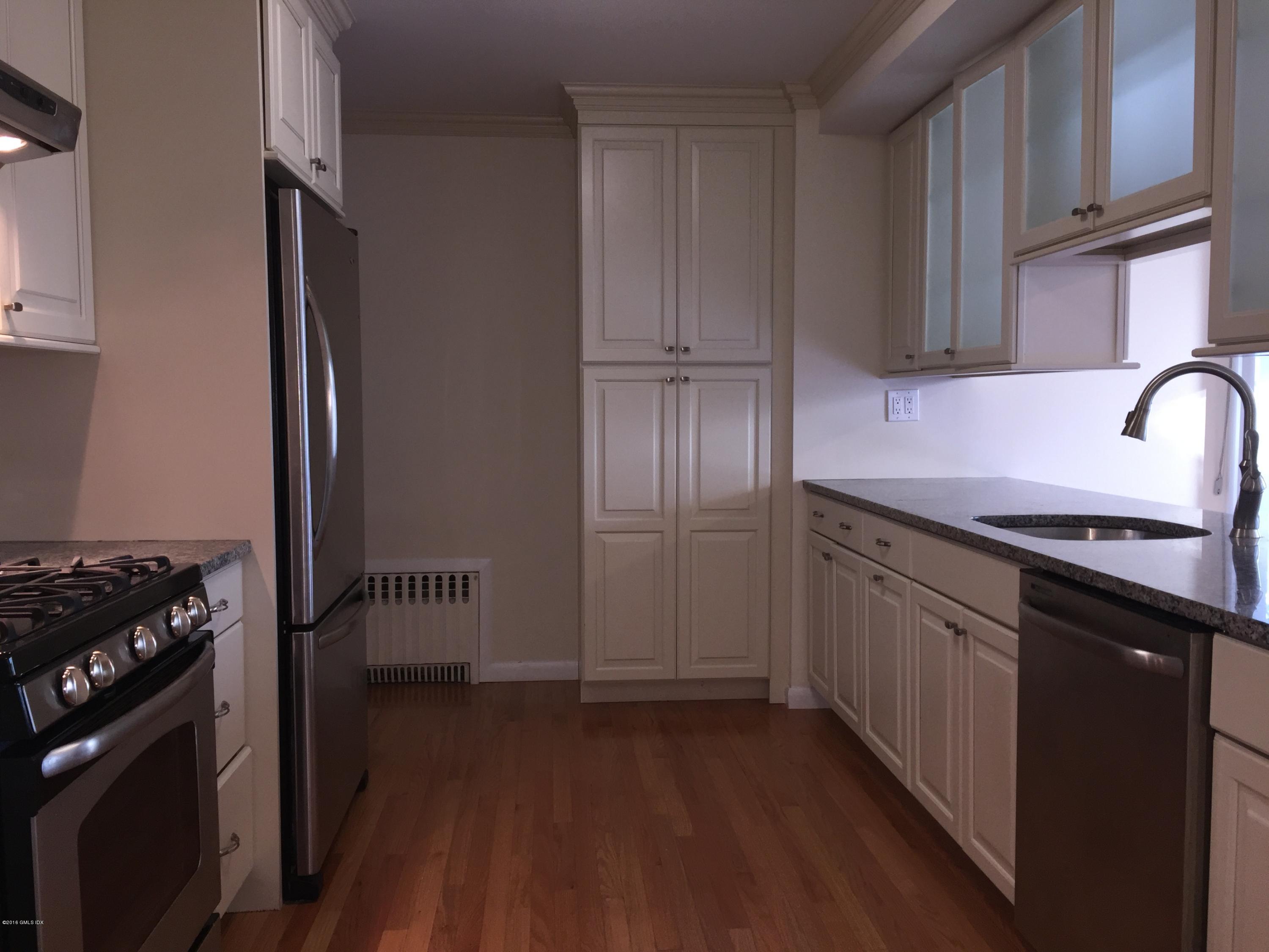 10 Miltiades Avenue Riverside, CT 06878 - Photo 4 of 16 a kitchen with granite countertop a sink stove and cabinets
