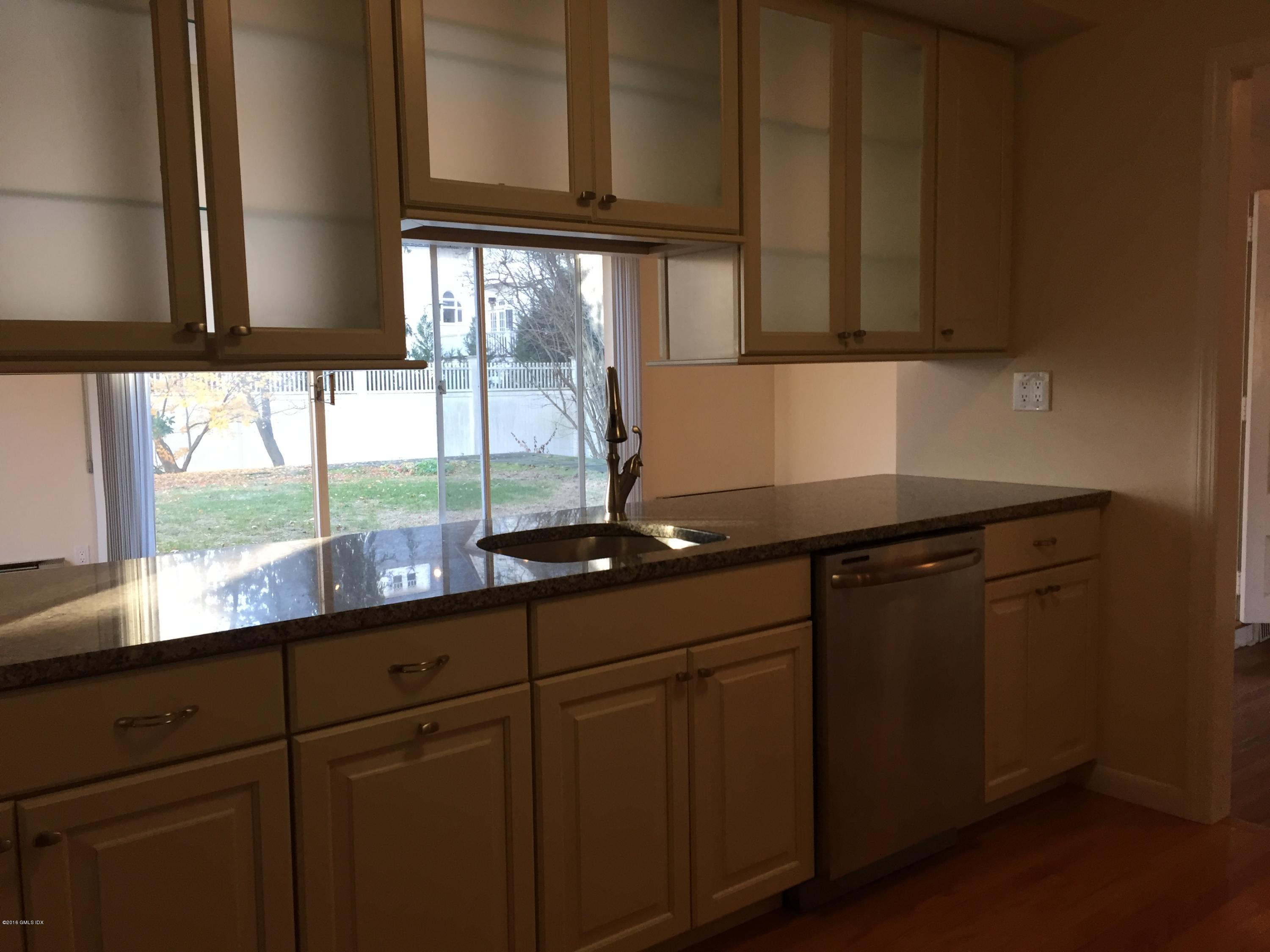 10 Miltiades Avenue Riverside, CT 06878 - Photo 5 of 16 a kitchen with a sink a window and cabinets