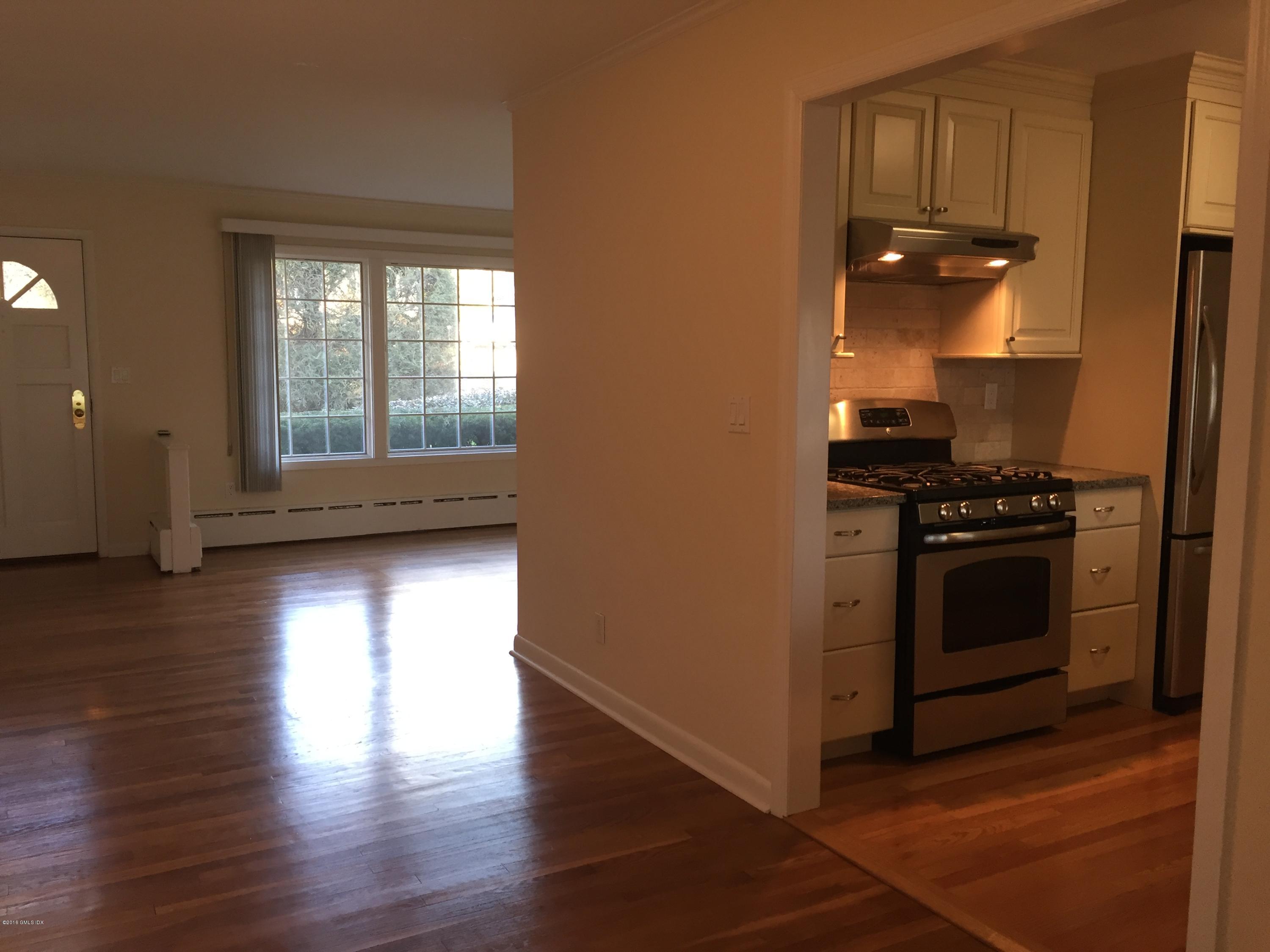 10 Miltiades Avenue Riverside, CT 06878 - Photo 6 of 16 a kitchen with granite countertop a stove and a refrigerator
