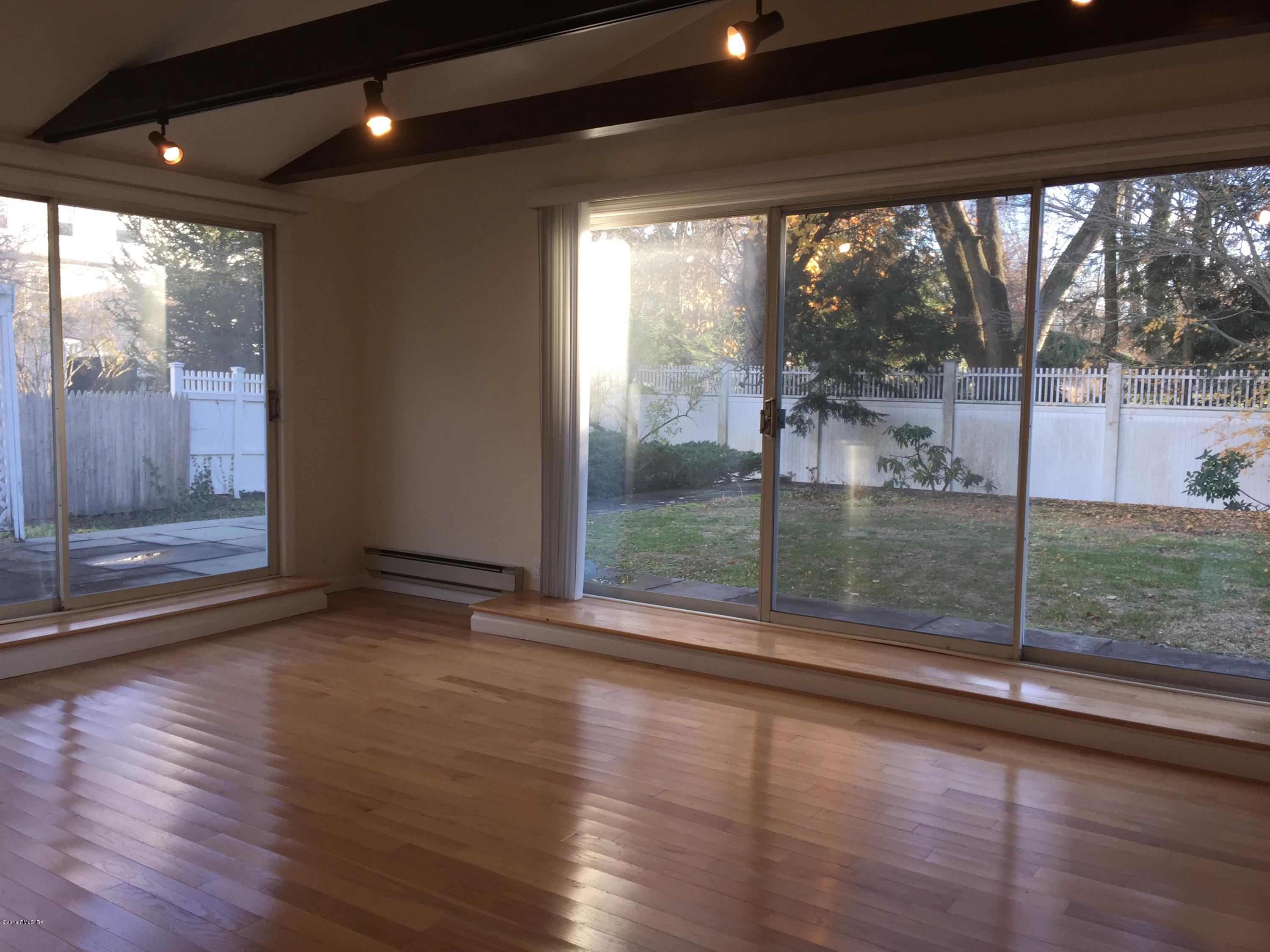 10 Miltiades Avenue Riverside, CT 06878 - Photo 7 of 16 a view of empty room with wooden floor and fan