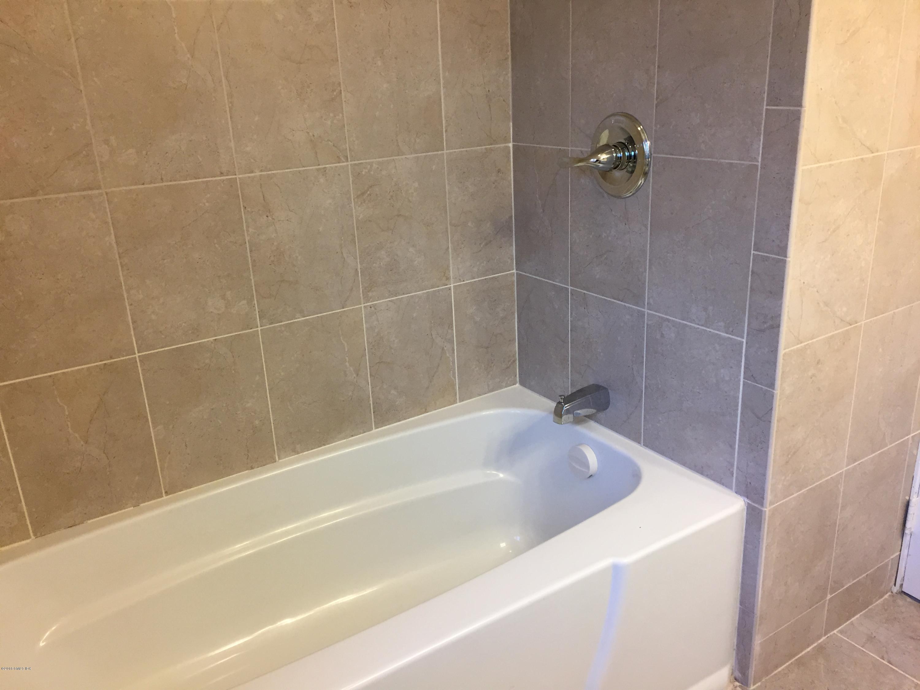 10 Miltiades Avenue Riverside, CT 06878 - Photo 9 of 16 a bathroom with a bathtub