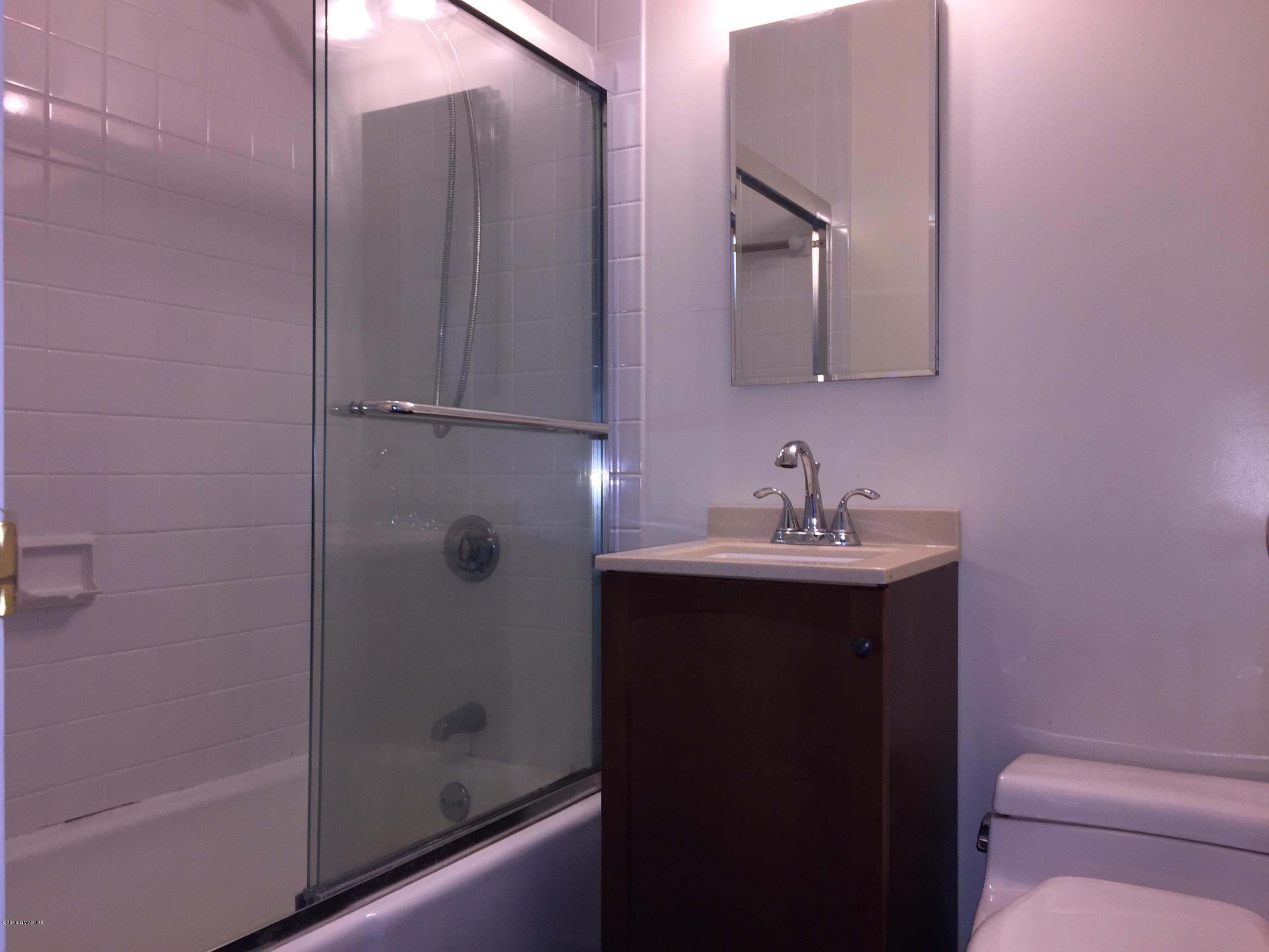 10 Miltiades Avenue Riverside, CT 06878 - Photo 10 of 16 a bathroom with a sink toilet and shower