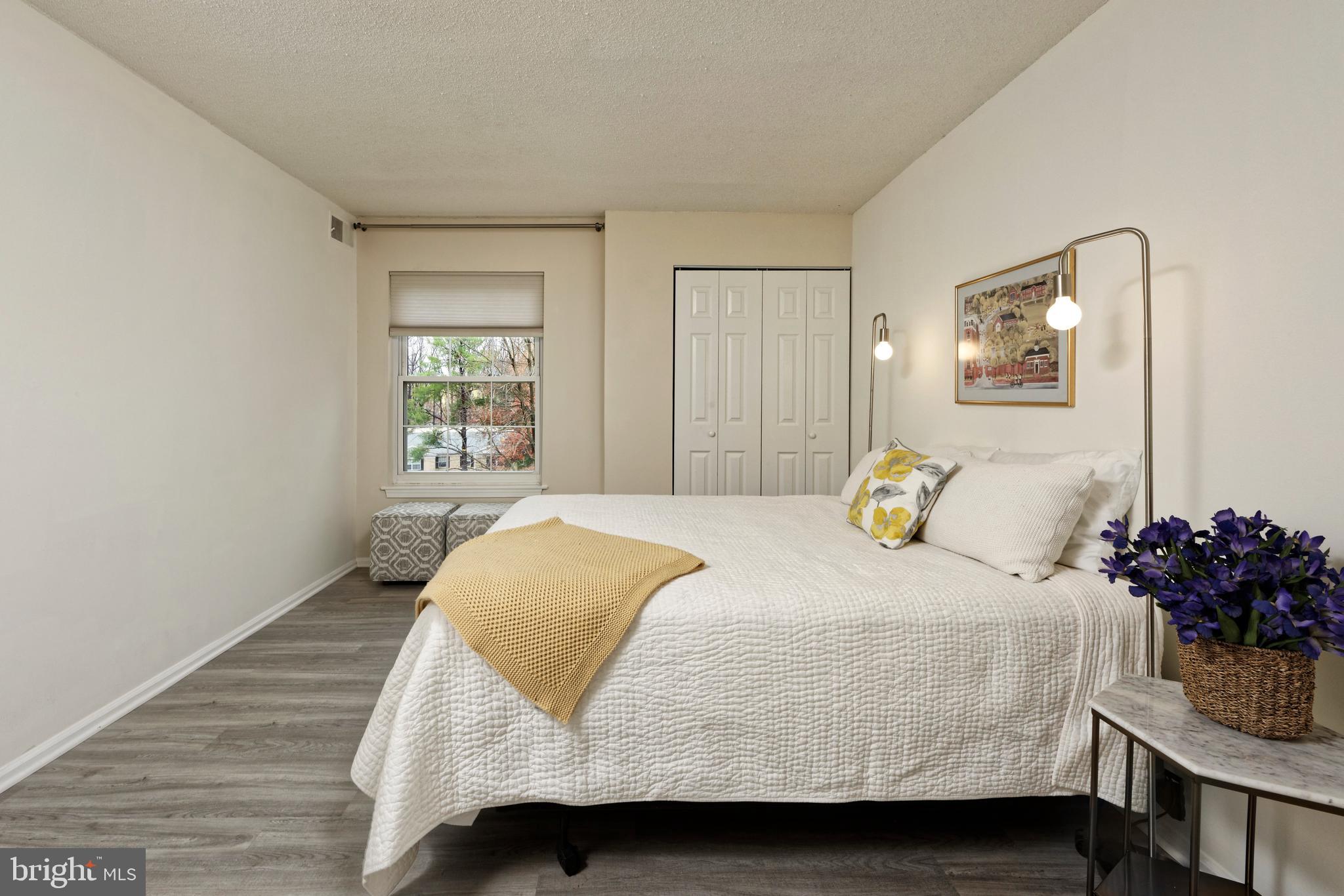 7680 Tremayne Place, Unit 308 McLean, VA 22102 - Photo 11 of 31 a bedroom with a bed and window