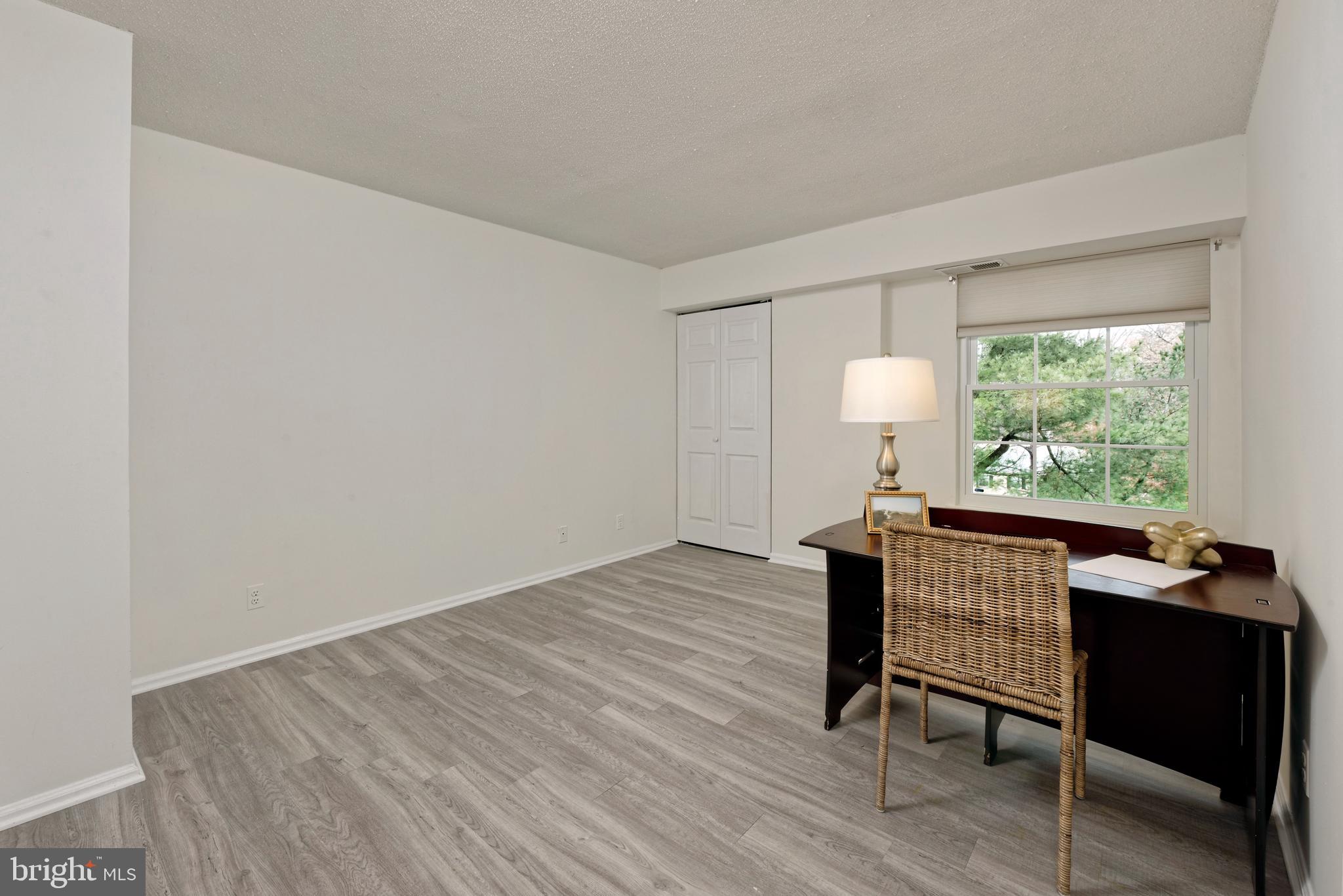7680 Tremayne Place, Unit 308 McLean, VA 22102 - Photo 14 of 31 a view of a livingroom with furniture and window