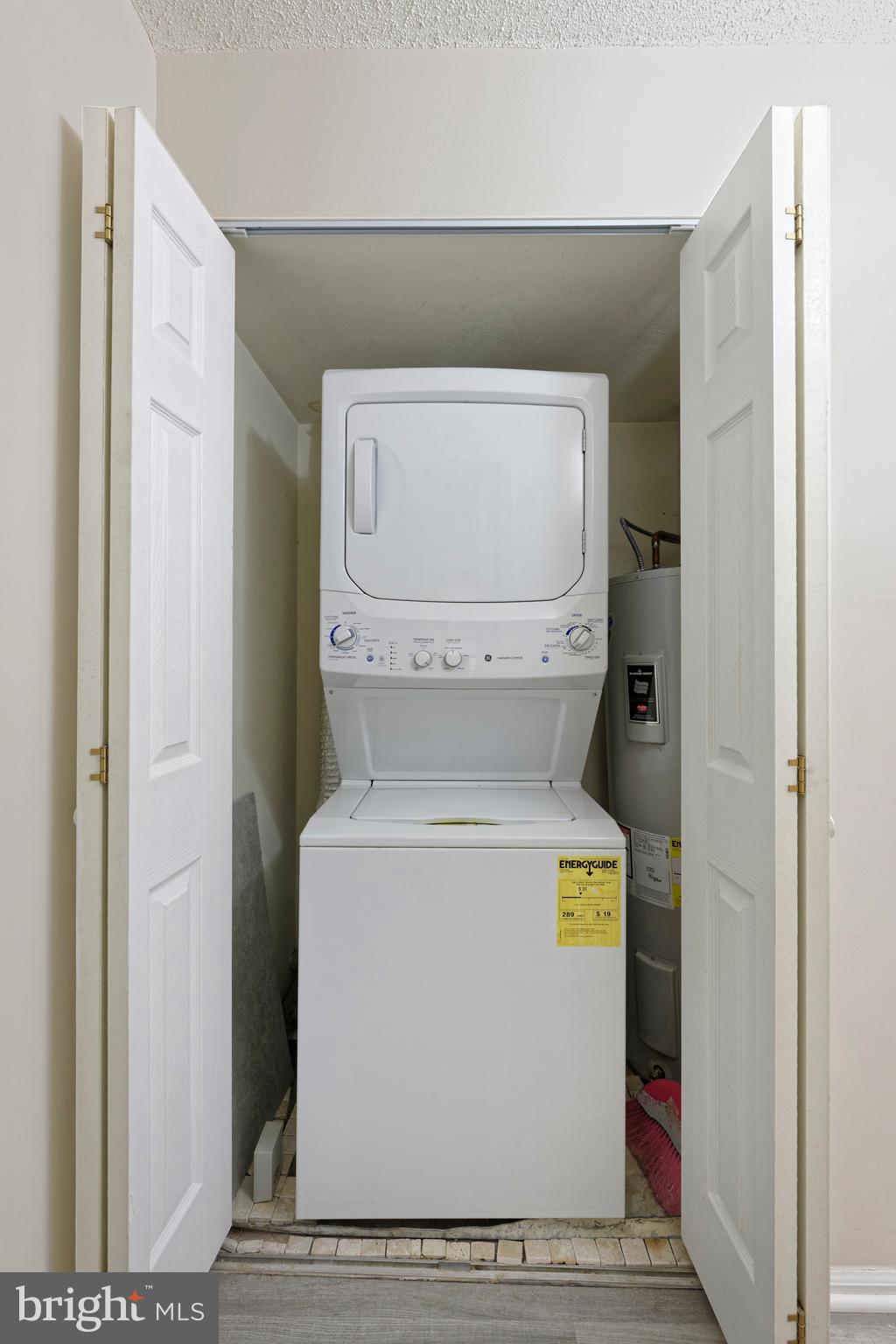 7680 Tremayne Place, Unit 308 McLean, VA 22102 - Photo 17 of 31 a utility room with dryer and washer